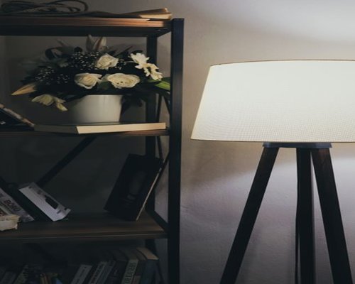 Cozy reading corner with a warm lamp in a living room